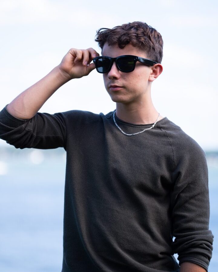 Putting on Relay glasses by the water.